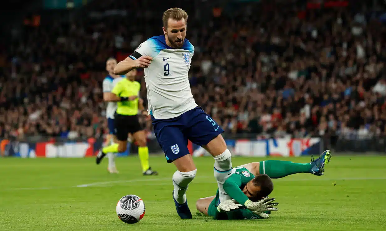 Harry Kane goes down under challenge from Maltese goalkeeper Henri Bonello